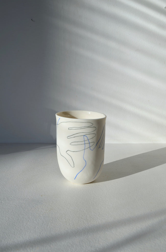 Porcelain vase with hands