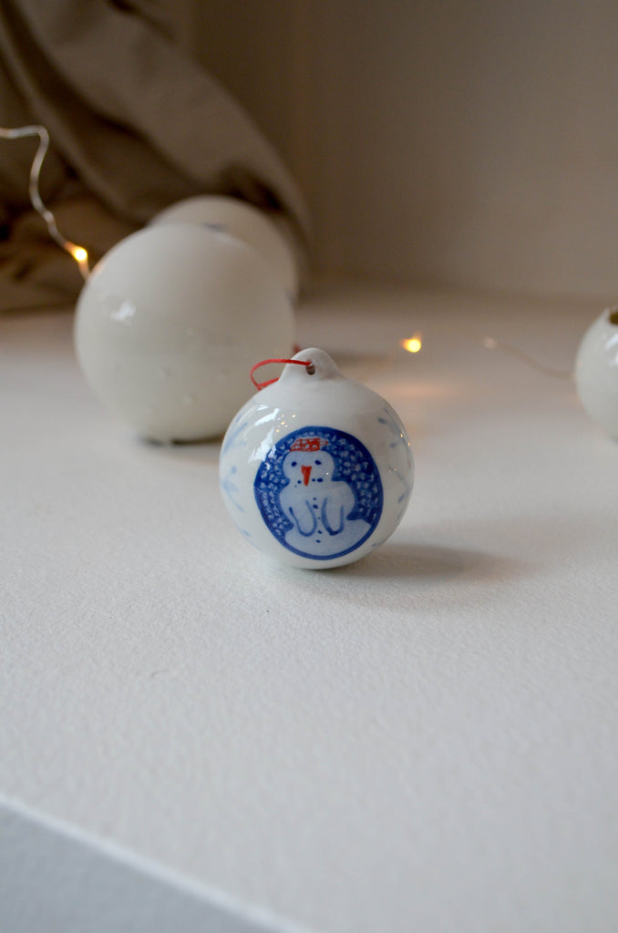 Porcelain hand painted Christmas bauble with a snowman