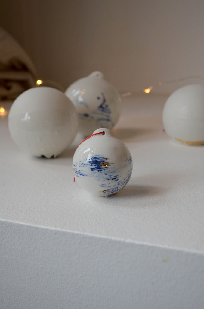 Porcelain hand painted Christmas bauble with gold and cobalt