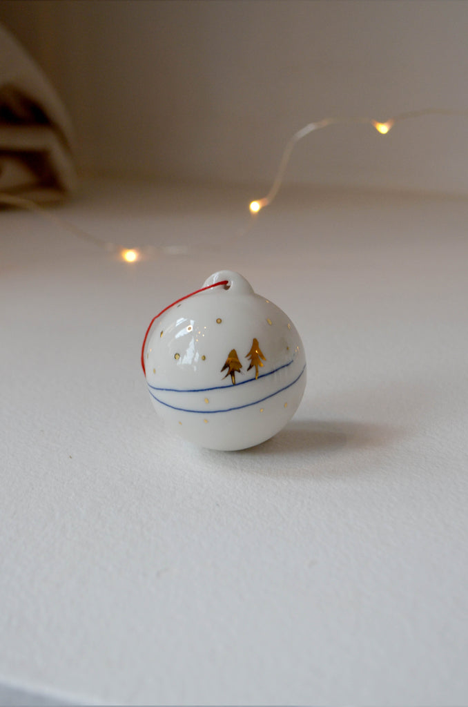Porcelain hand painted Christmas bauble with a winter motif